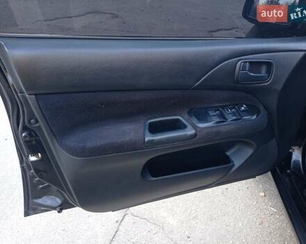 Чорний Міцубісі Lancer, об'ємом двигуна 1.58 л та пробігом 286 тис. км за 4950 $, фото 4 на Automoto.ua