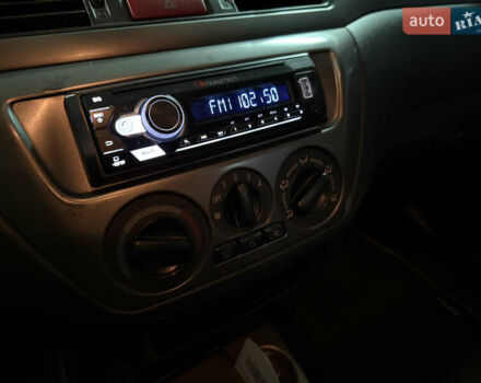 Чорний Міцубісі Lancer, об'ємом двигуна 1.58 л та пробігом 212 тис. км за 5500 $, фото 9 на Automoto.ua