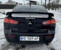 Черный Мицубиси Лансер, объемом двигателя 2 л и пробегом 280 тыс. км за 6800 $, фото 4 на Automoto.ua