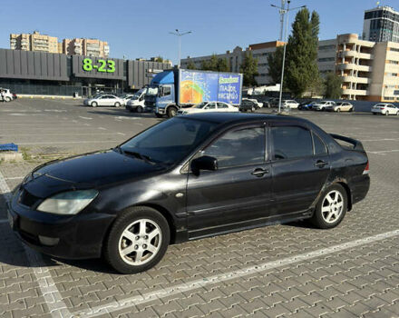 Черный Мицубиси Лансер, объемом двигателя 1.58 л и пробегом 364 тыс. км за 3000 $, фото 4 на Automoto.ua