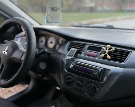 Черный Мицубиси Лансер, объемом двигателя 1.59 л и пробегом 348 тыс. км за 4200 $, фото 8 на Automoto.ua