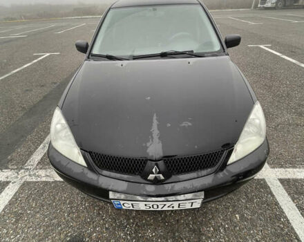 Черный Мицубиси Лансер, объемом двигателя 1.58 л и пробегом 214 тыс. км за 4400 $, фото 9 на Automoto.ua