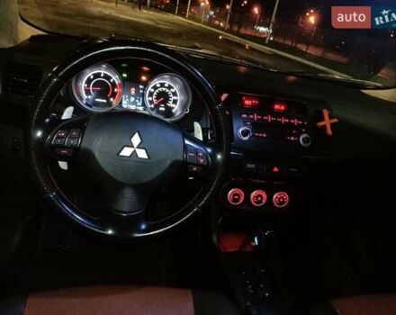 Черный Мицубиси Лансер, объемом двигателя 2 л и пробегом 240 тыс. км за 6400 $, фото 15 на Automoto.ua