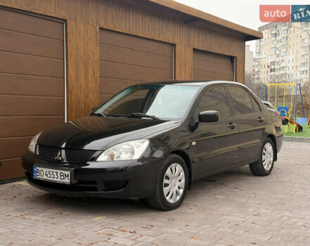 Чорний Міцубісі Lancer, об'ємом двигуна 1.6 л та пробігом 265 тис. км за 4700 $, фото 14 на Automoto.ua