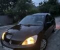 Чорний Міцубісі Lancer, об'ємом двигуна 1.6 л та пробігом 250 тис. км за 3900 $, фото 1 на Automoto.ua
