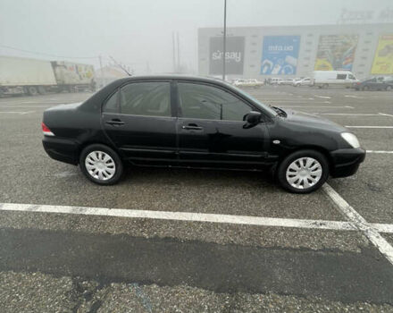 Черный Мицубиси Лансер, объемом двигателя 1.58 л и пробегом 214 тыс. км за 4400 $, фото 8 на Automoto.ua