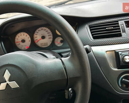 Чорний Міцубісі Lancer, об'ємом двигуна 1.58 л та пробігом 167 тис. км за 4800 $, фото 13 на Automoto.ua