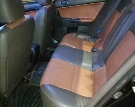 Черный Мицубиси Лансер, объемом двигателя 2 л и пробегом 240 тыс. км за 6400 $, фото 10 на Automoto.ua