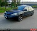 Черный Мицубиси Лансер, объемом двигателя 1.6 л и пробегом 200 тыс. км за 3000 $, фото 1 на Automoto.ua
