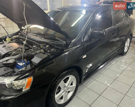 Черный Мицубиси Лансер, объемом двигателя 2 л и пробегом 200 тыс. км за 8000 $, фото 23 на Automoto.ua