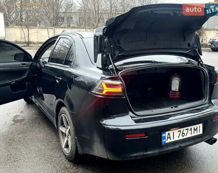 Черный Мицубиси Лансер, объемом двигателя 2 л и пробегом 217 тыс. км за 7000 $, фото 33 на Automoto.ua