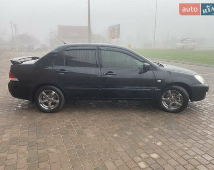 Черный Мицубиси Лансер, объемом двигателя 1.58 л и пробегом 211 тыс. км за 6333 $, фото 4 на Automoto.ua
