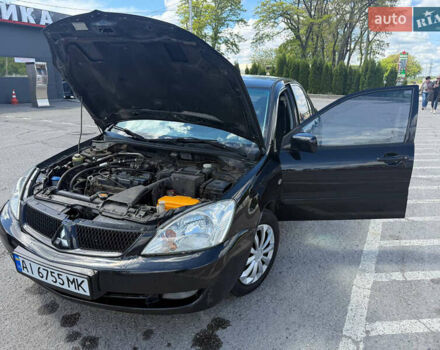 Чорний Міцубісі Lancer, об'ємом двигуна 1.6 л та пробігом 292 тис. км за 3600 $, фото 13 на Automoto.ua