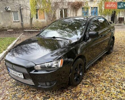 Черный Мицубиси Лансер, объемом двигателя 2 л и пробегом 260 тыс. км за 6100 $, фото 3 на Automoto.ua