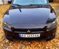 Черный Мицубиси Лансер, объемом двигателя 2 л и пробегом 260 тыс. км за 7000 $, фото 1 на Automoto.ua
