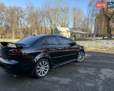 Черный Мицубиси Лансер, объемом двигателя 2 л и пробегом 236 тыс. км за 6450 $, фото 4 на Automoto.ua