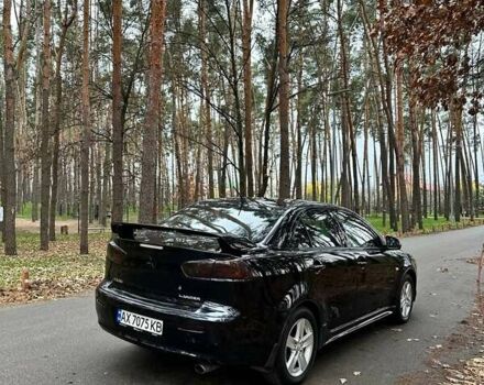 Черный Мицубиси Лансер, объемом двигателя 2 л и пробегом 216 тыс. км за 5600 $, фото 3 на Automoto.ua