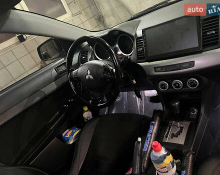 Черный Мицубиси Лансер, объемом двигателя 2 л и пробегом 200 тыс. км за 8000 $, фото 19 на Automoto.ua