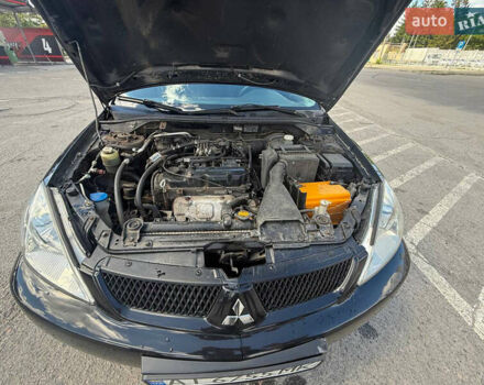 Чорний Міцубісі Lancer, об'ємом двигуна 1.6 л та пробігом 292 тис. км за 3600 $, фото 11 на Automoto.ua