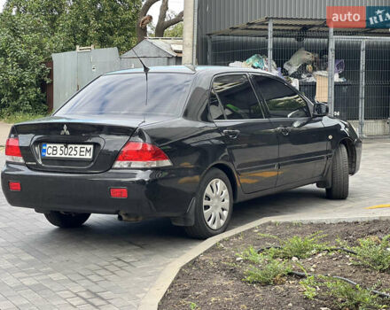 Черный Мицубиси Лансер, объемом двигателя 1.6 л и пробегом 167 тыс. км за 4850 $, фото 3 на Automoto.ua