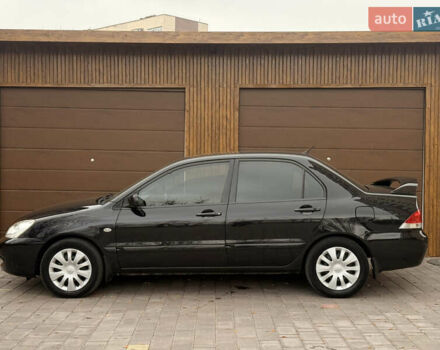 Чорний Міцубісі Lancer, об'ємом двигуна 1.6 л та пробігом 265 тис. км за 4700 $, фото 13 на Automoto.ua