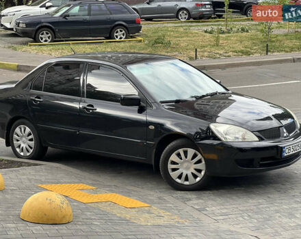 Черный Мицубиси Лансер, объемом двигателя 1.6 л и пробегом 167 тыс. км за 4850 $, фото 6 на Automoto.ua