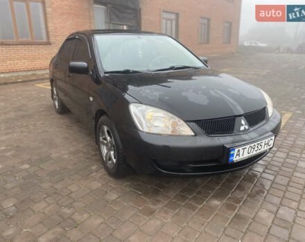 Черный Мицубиси Лансер, объемом двигателя 1.58 л и пробегом 211 тыс. км за 6333 $, фото 15 на Automoto.ua