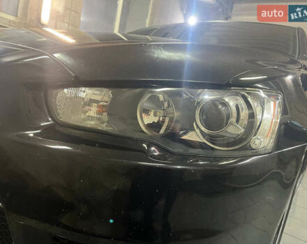 Черный Мицубиси Лансер, объемом двигателя 2 л и пробегом 200 тыс. км за 8000 $, фото 13 на Automoto.ua