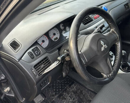 Черный Мицубиси Лансер, объемом двигателя 1.58 л и пробегом 312 тыс. км за 4900 $, фото 5 на Automoto.ua