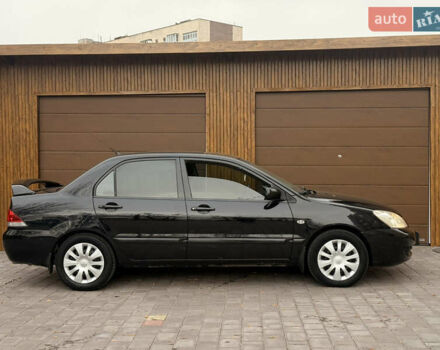 Чорний Міцубісі Lancer, об'ємом двигуна 1.6 л та пробігом 265 тис. км за 4700 $, фото 8 на Automoto.ua