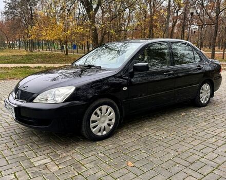 Черный Мицубиси Лансер, объемом двигателя 1.6 л и пробегом 185 тыс. км за 5500 $, фото 1 на Automoto.ua