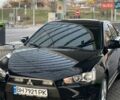 Черный Мицубиси Лансер, объемом двигателя 2 л и пробегом 104 тыс. км за 7200 $, фото 1 на Automoto.ua