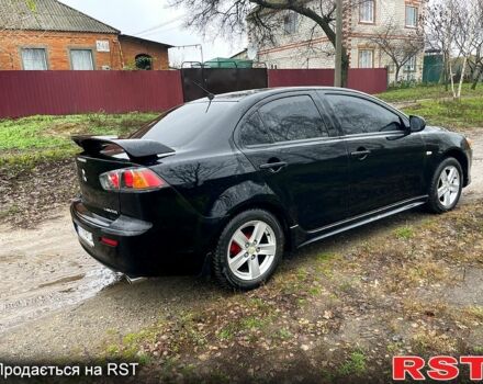 Черный Мицубиси Лансер, объемом двигателя 2 л и пробегом 226 тыс. км за 6600 $, фото 7 на Automoto.ua