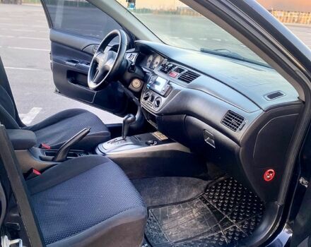 Чорний Міцубісі Lancer, об'ємом двигуна 1.6 л та пробігом 375 тис. км за 4899 $, фото 9 на Automoto.ua