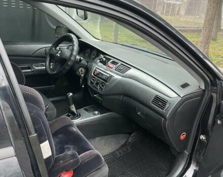 Черный Мицубиси Лансер, объемом двигателя 1.58 л и пробегом 214 тыс. км за 4400 $, фото 14 на Automoto.ua