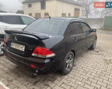 Черный Мицубиси Лансер, объемом двигателя 1.58 л и пробегом 211 тыс. км за 6333 $, фото 23 на Automoto.ua