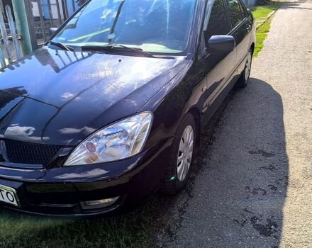 Черный Мицубиси Лансер, объемом двигателя 1.6 л и пробегом 232 тыс. км за 4400 $, фото 2 на Automoto.ua