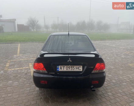 Черный Мицубиси Лансер, объемом двигателя 1.58 л и пробегом 211 тыс. км за 6333 $, фото 8 на Automoto.ua