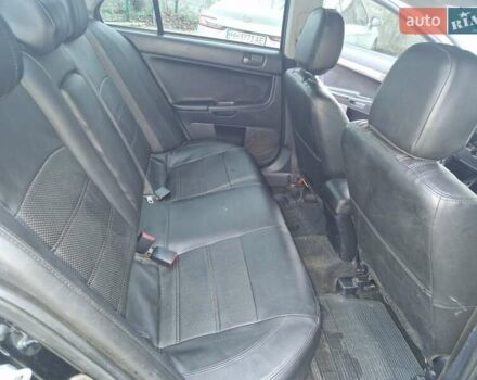 Чорний Міцубісі Lancer, об'ємом двигуна 2 л та пробігом 300 тис. км за 6000 $, фото 5 на Automoto.ua