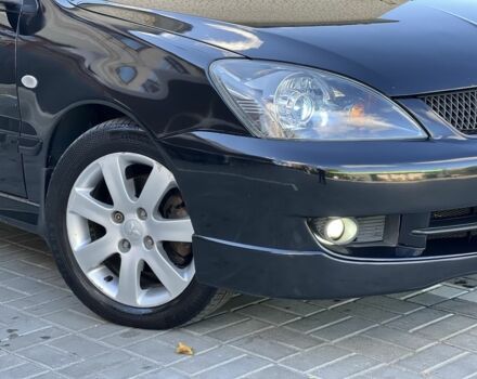 Черный Мицубиси Лансер, объемом двигателя 1.6 л и пробегом 230 тыс. км за 4500 $, фото 5 на Automoto.ua