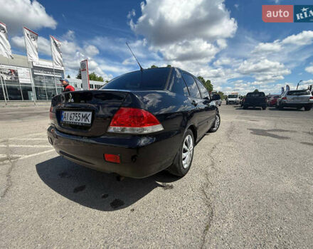 Чорний Міцубісі Lancer, об'ємом двигуна 1.6 л та пробігом 292 тис. км за 3600 $, фото 6 на Automoto.ua