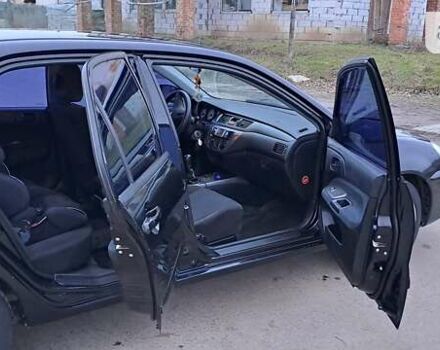 Чорний Міцубісі Lancer, об'ємом двигуна 1.6 л та пробігом 131 тис. км за 6000 $, фото 8 на Automoto.ua