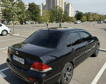 Черный Мицубиси Лансер, объемом двигателя 1.6 л и пробегом 321 тыс. км за 5000 $, фото 6 на Automoto.ua