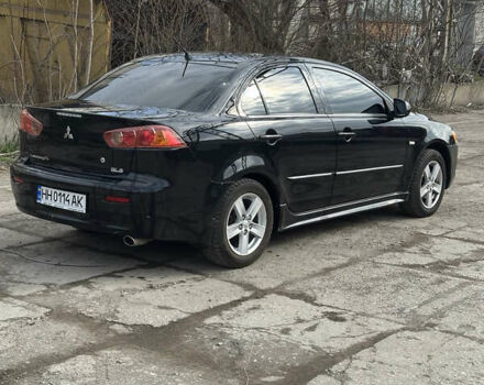 Черный Мицубиси Лансер, объемом двигателя 2 л и пробегом 172 тыс. км за 6100 $, фото 2 на Automoto.ua