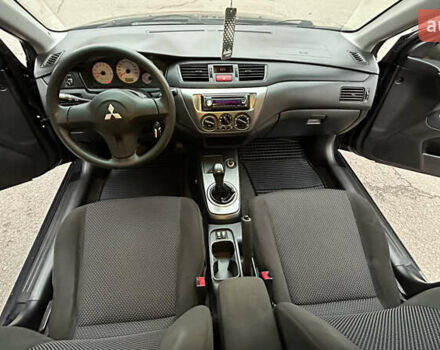Чорний Міцубісі Lancer, об'ємом двигуна 1.58 л та пробігом 167 тис. км за 4800 $, фото 14 на Automoto.ua