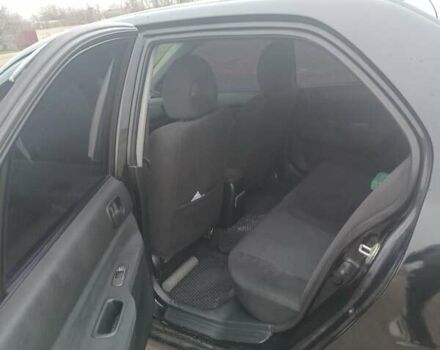 Чорний Міцубісі Lancer, об'ємом двигуна 1.58 л та пробігом 233 тис. км за 4800 $, фото 5 на Automoto.ua