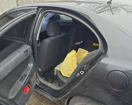 Черный Мицубиси Лансер, объемом двигателя 1.5 л и пробегом 300 тыс. км за 2500 $, фото 2 на Automoto.ua