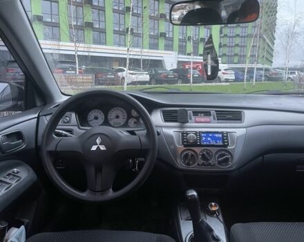 Черный Мицубиси Лансер, объемом двигателя 1.6 л и пробегом 226 тыс. км за 3750 $, фото 7 на Automoto.ua