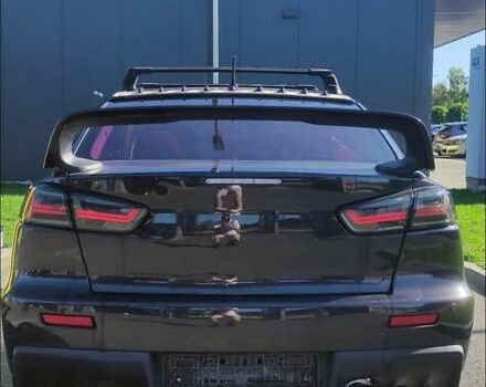 Чорний Міцубісі Lancer, об'ємом двигуна 2 л та пробігом 134 тис. км за 29034 $, фото 3 на Automoto.ua