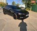 Черный Мицубиси Лансер, объемом двигателя 2 л и пробегом 213 тыс. км за 8700 $, фото 1 на Automoto.ua